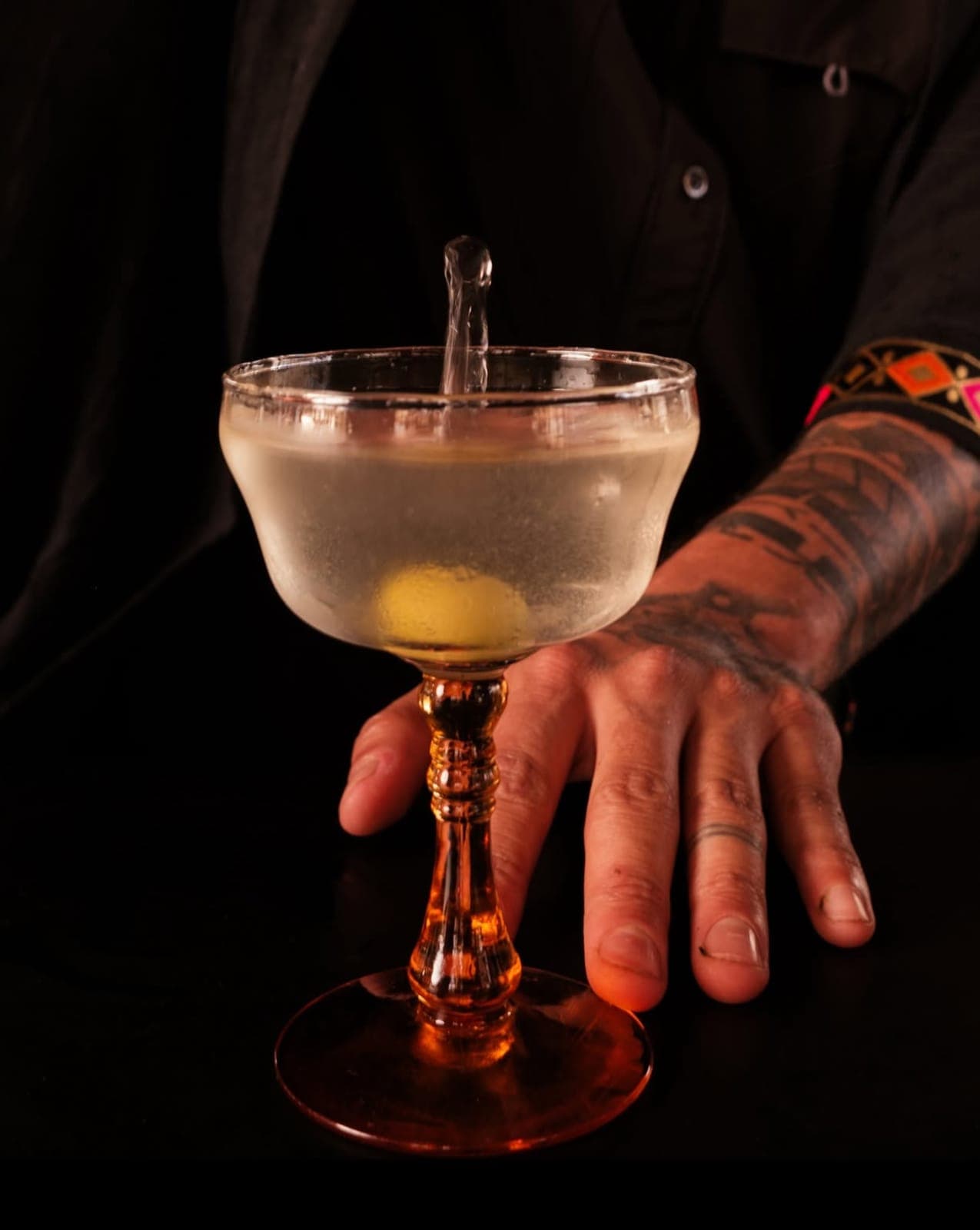 A martini in a coupe at the bar