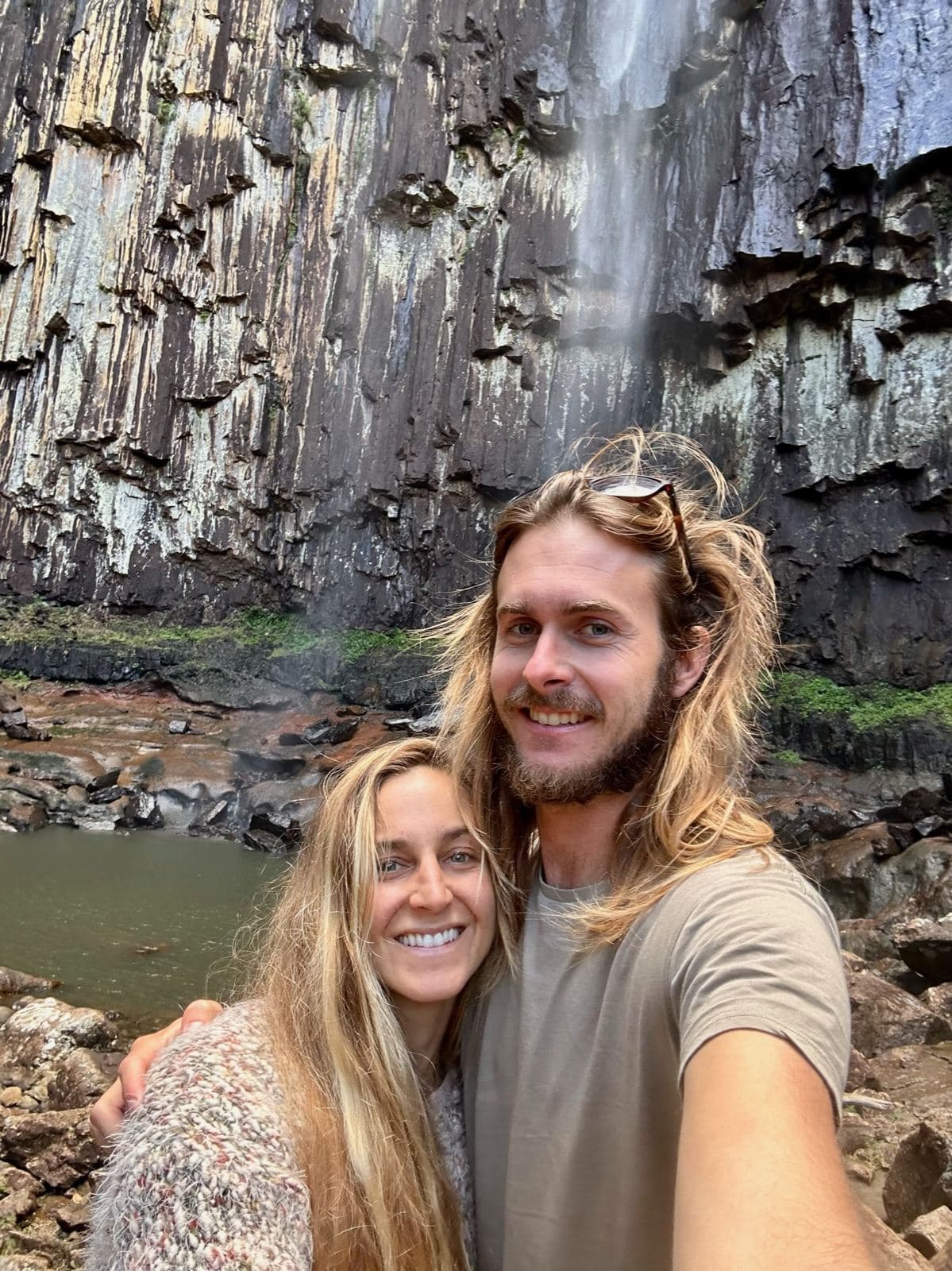 A selfie in front of a basalt waterfall