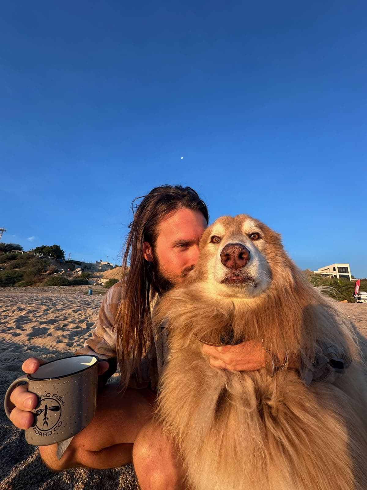 A beach morning: coffee and Captain