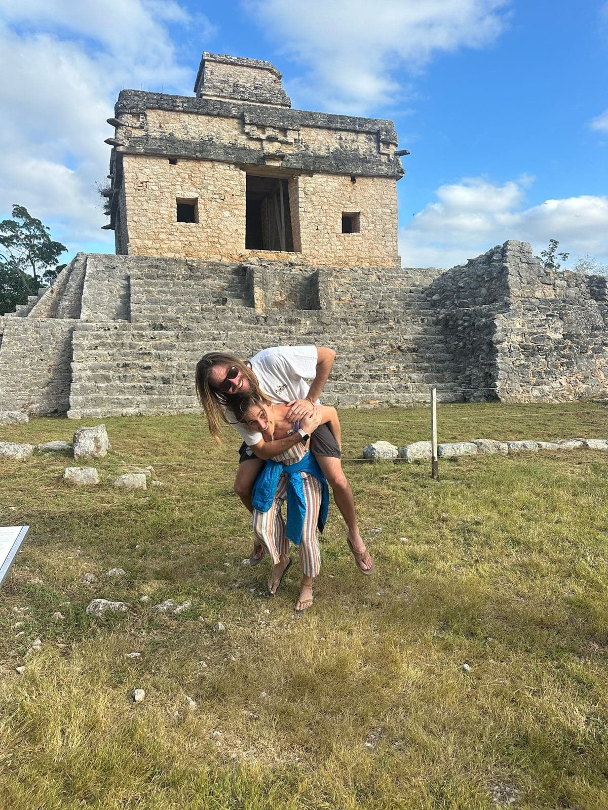 A piggyback in front of a Maya ruin